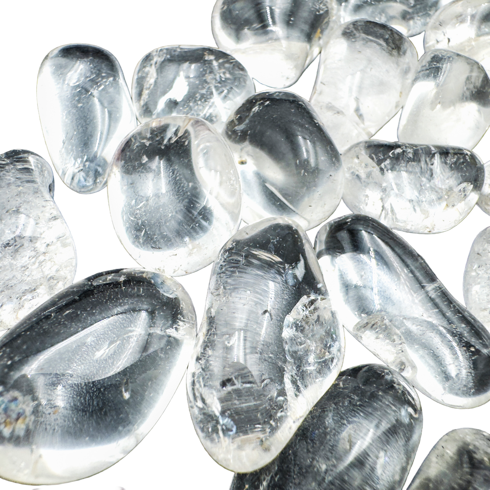 Close-up of polished Clear Quartz tumbled stones showing crystalline depth and natural inclusions, AAA grade Brazil