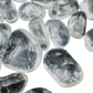 Detail of Grade AAA Clear Quartz tumbled stones with visible internal clarity, ethically sourced Minas Gerais, Brazil