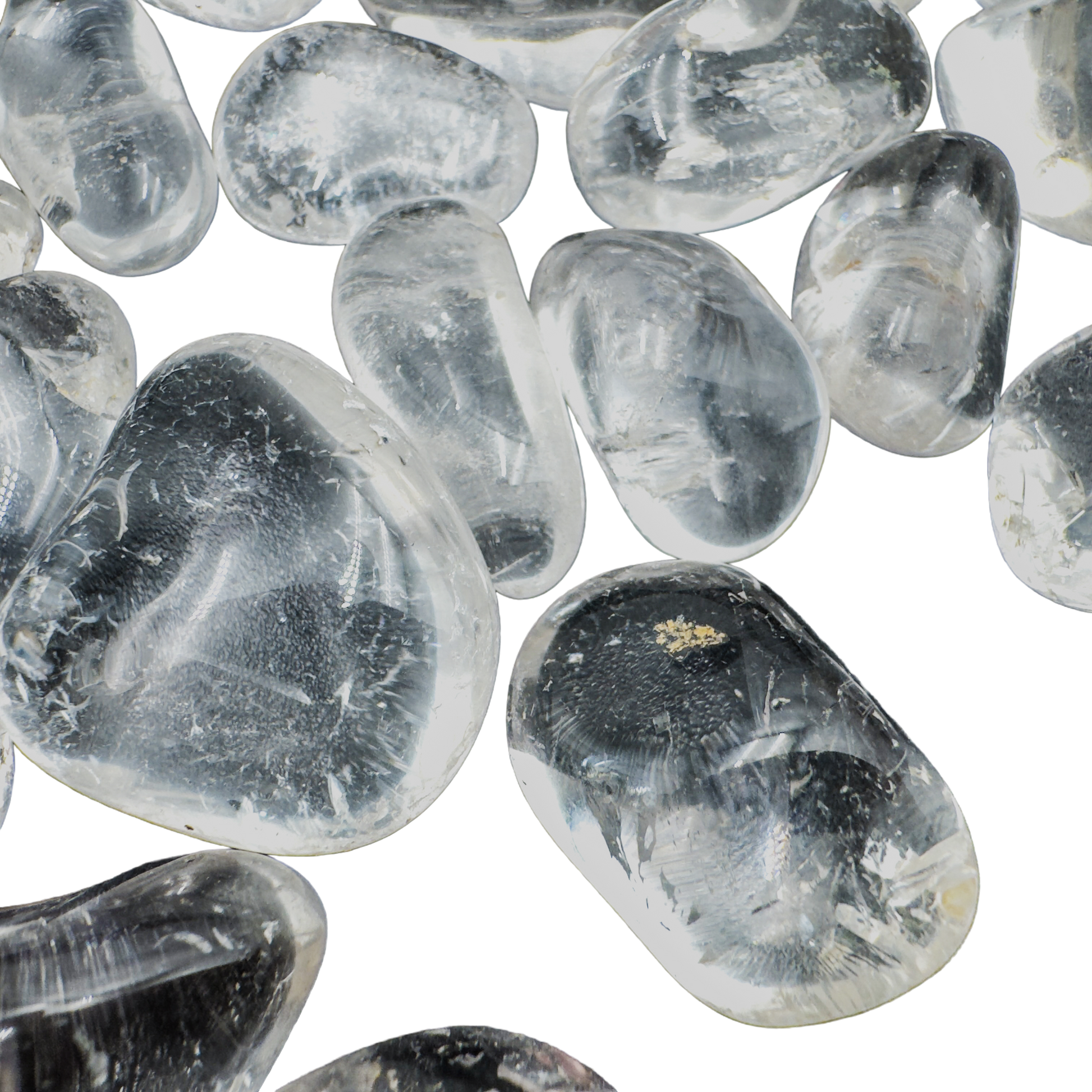 Detail of Grade AAA Clear Quartz tumbled stones with visible internal clarity, ethically sourced Minas Gerais, Brazil