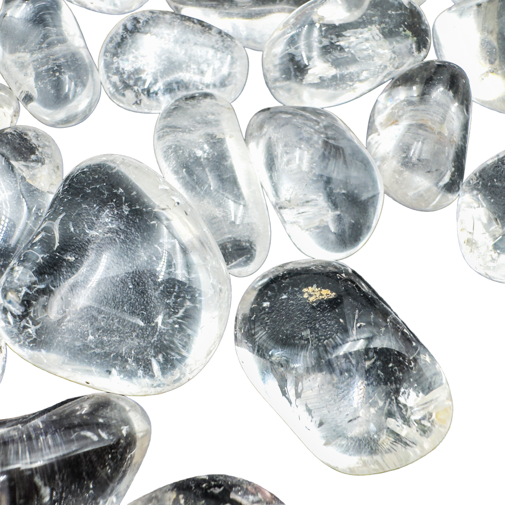 Detail of Grade AAA Clear Quartz tumbled stones with visible internal clarity, ethically sourced Minas Gerais, Brazil