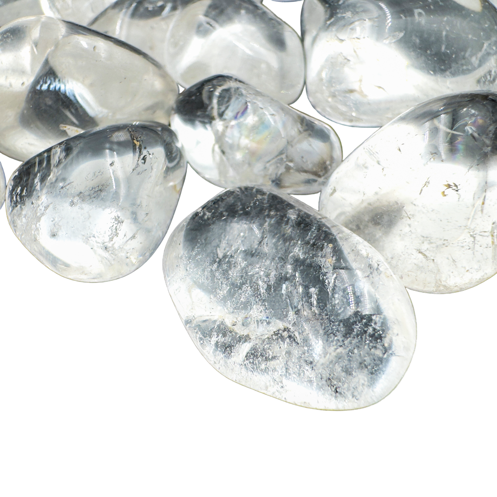 Side view of Clear Quartz tumbled stones showing deep crystalline clarity, hand-polished AAA grade from Minas Gerais