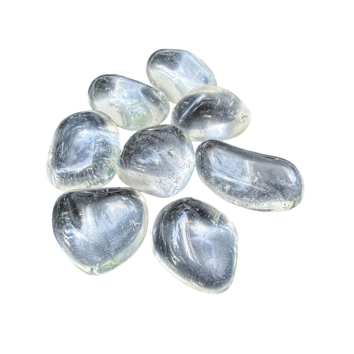 Overhead flat-lay of Clear Quartz tumbled stones showing piece count per pound