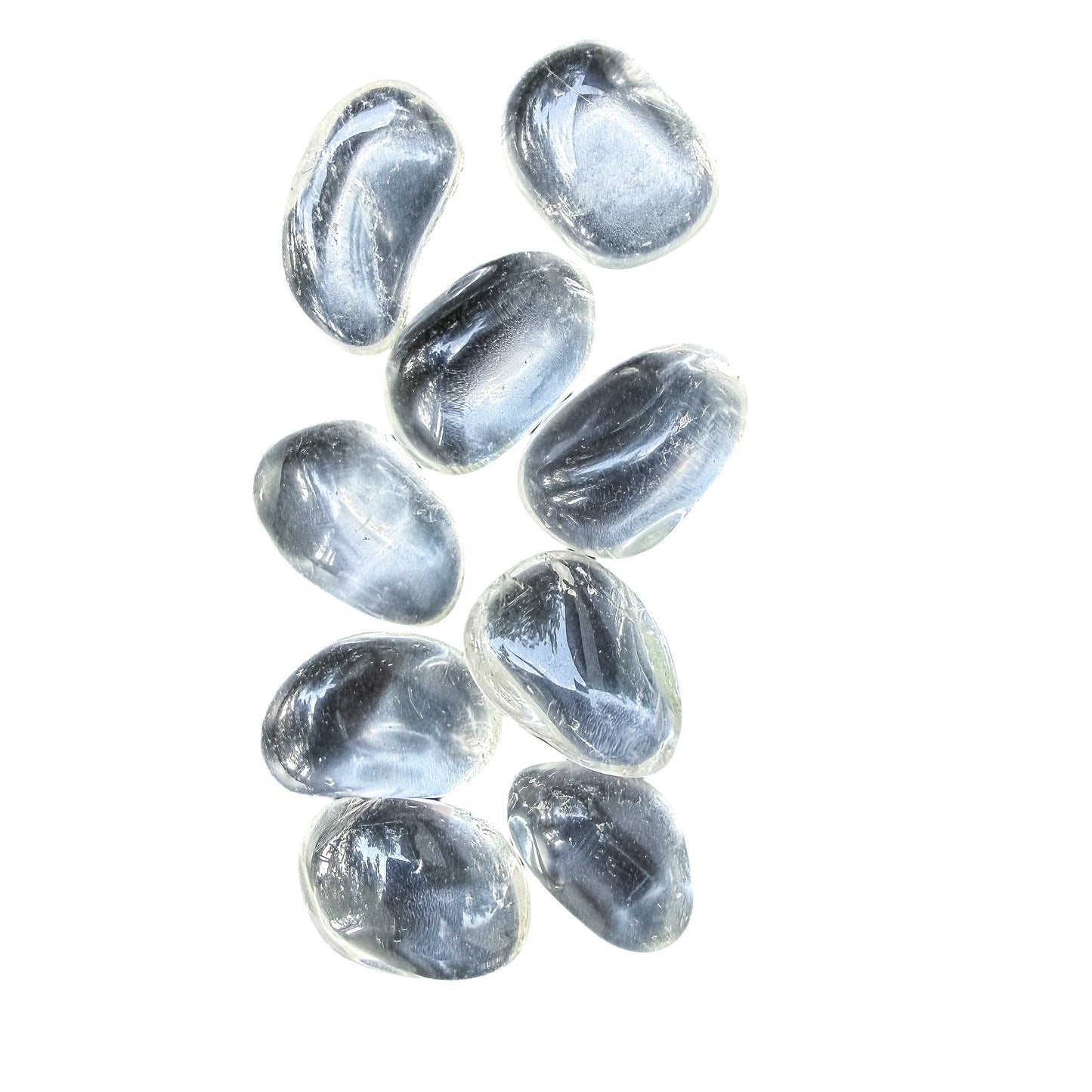 Side view of Clear Quartz tumbled stones showing the depth of the polish