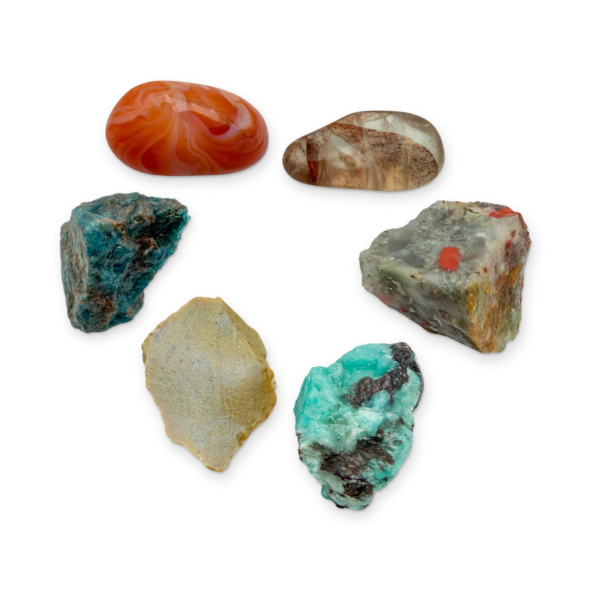 Confidence Crystal Kit: banded carnelian, fire quartz, bloodstone, amazonite, yellow jasper and blue apatite, shown together on white