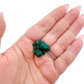 Hand holding the long crystal seam to show how small a 1.52 inch collector dioptase is