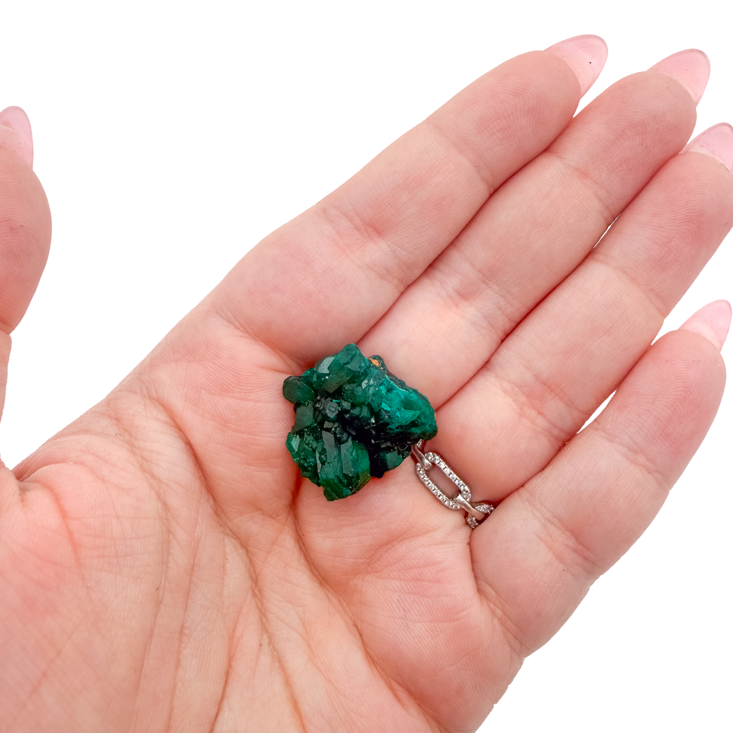 Hand holding the long crystal seam to show how small a 1.52 inch collector dioptase is