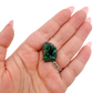 Scale shot of the upright nodule, 11.4 g of Congolese dioptase cupped in a hand