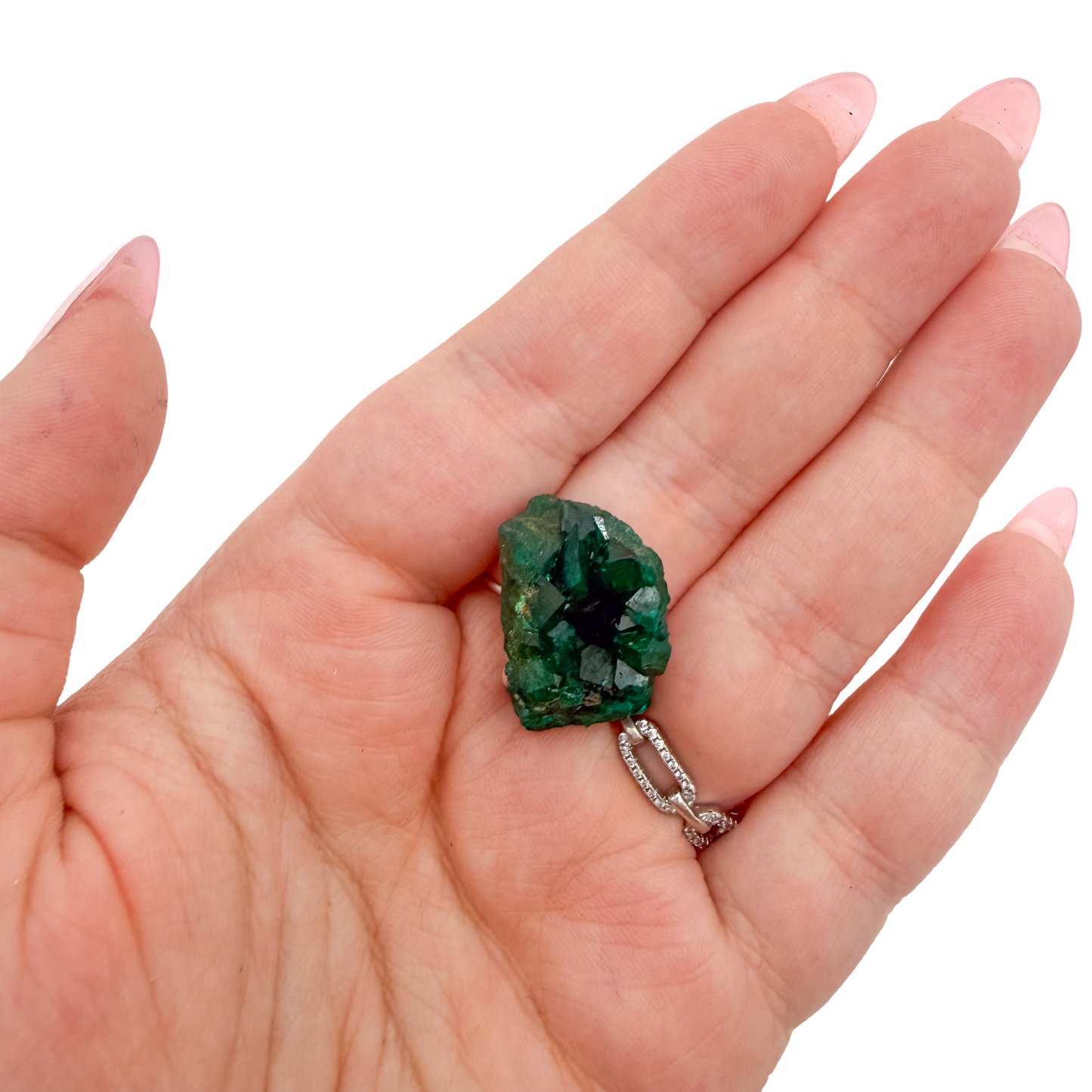 Scale shot of the upright nodule, 11.4 g of Congolese dioptase cupped in a hand