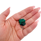 Scale shot of the glassy green face, 8.1 g of Congolese dioptase cupped in a hand