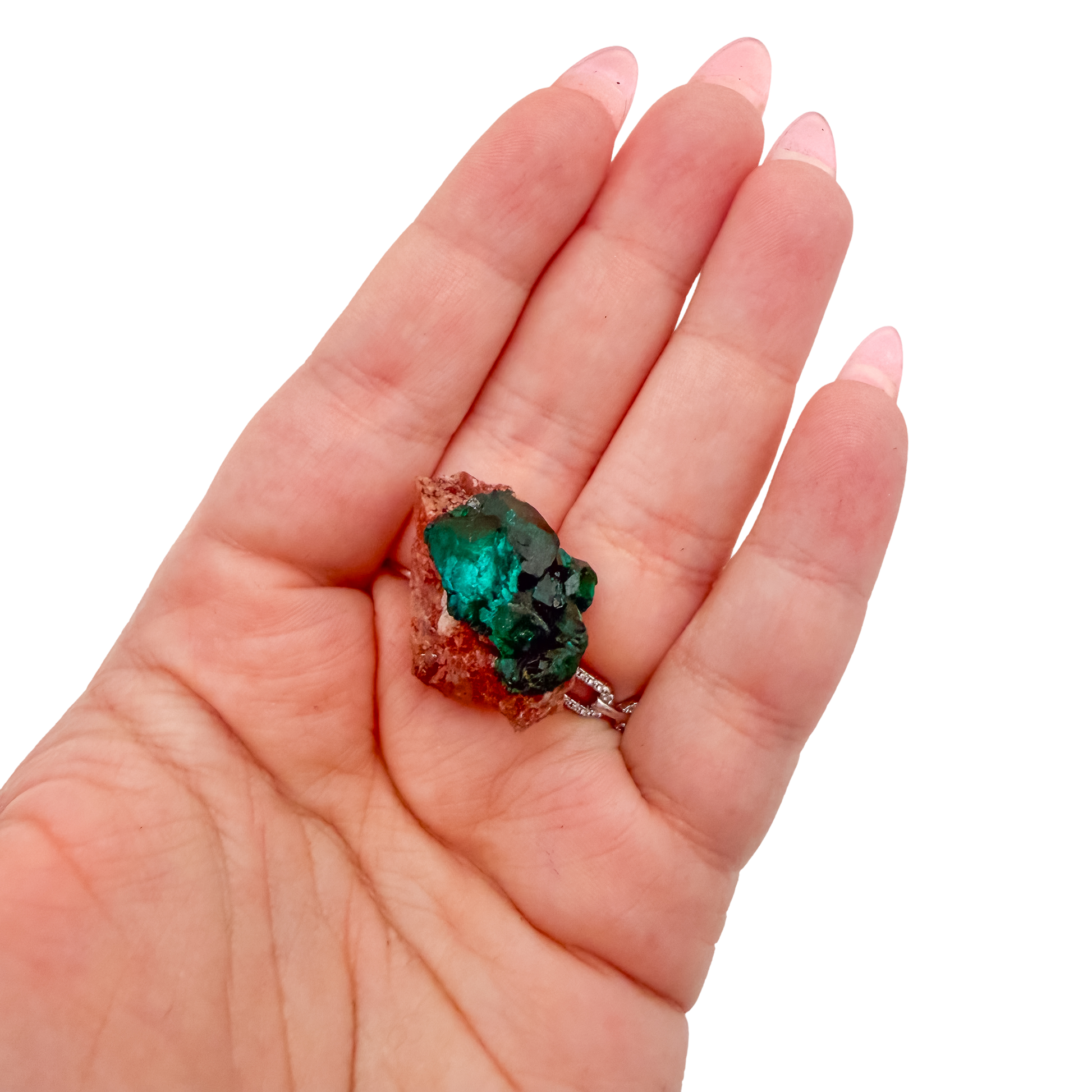 Hand holding the even green coverage to show how small a 0.89 inch collector dioptase is