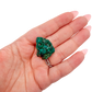 Scale shot of the slim flat piece, 8.6 g of Congolese dioptase cupped in a hand
