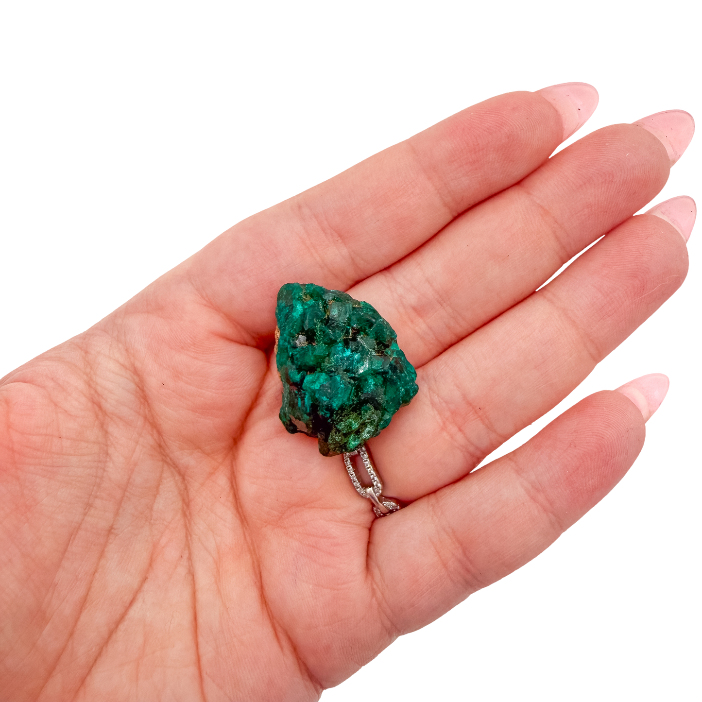 Scale shot of the slim flat piece, 8.6 g of Congolese dioptase cupped in a hand