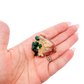 Scale shot of the slender thumbnail, 6.1 g of Congolese dioptase cupped in a hand