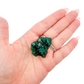 Scale shot of the thin flat chip, 5.1 g of Congolese dioptase cupped in a hand