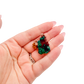 Hand holding the neat thumbnail to show how small a 0.82 inch collector dioptase is