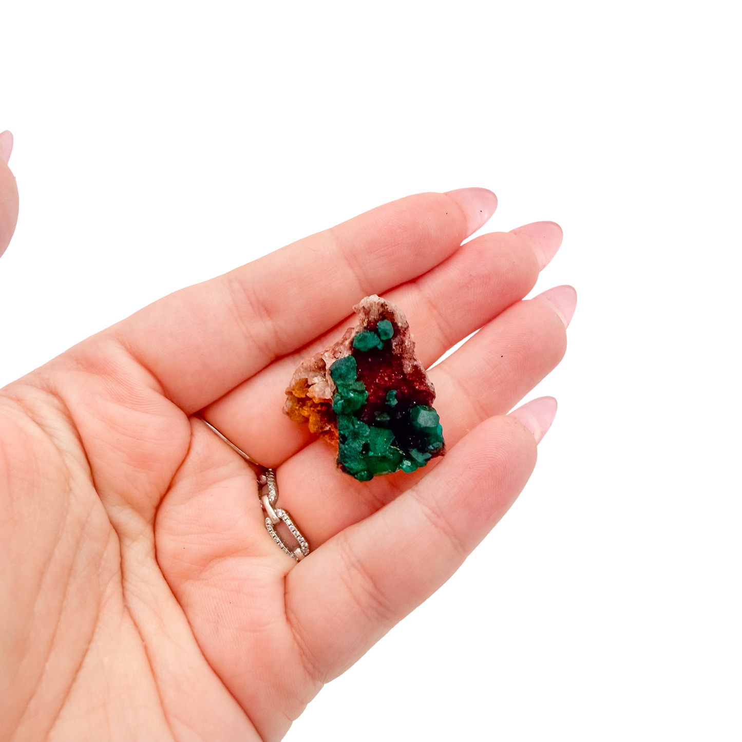 Hand holding the neat thumbnail to show how small a 0.82 inch collector dioptase is