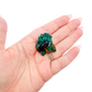 Scale shot of the bright slim piece, 7.5 g of Congolese dioptase cupped in a hand