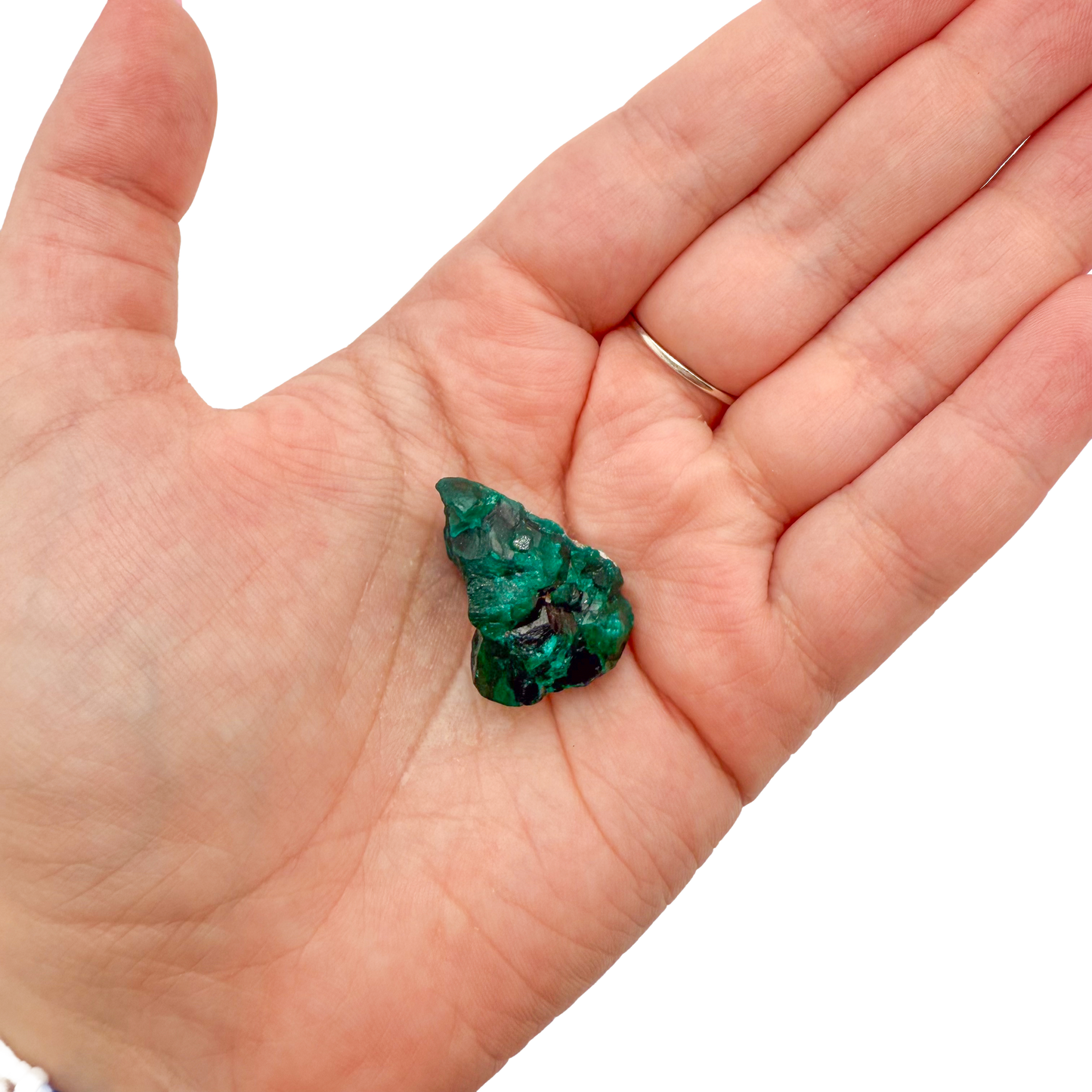 Dioptase crystal specimen from the Republic of the Congo held in hand for scale, deep emerald-green druzy, specimen 12