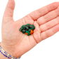 Dioptase crystal specimen from the Republic of the Congo held in hand for scale, deep emerald-green druzy, specimen 13
