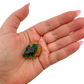 Dioptase crystal specimen from the Republic of the Congo held in hand for scale, deep emerald-green druzy, specimen 20
