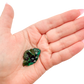 Dioptase crystal specimen from the Republic of the Congo held in hand for scale, deep emerald-green druzy, specimen 8
