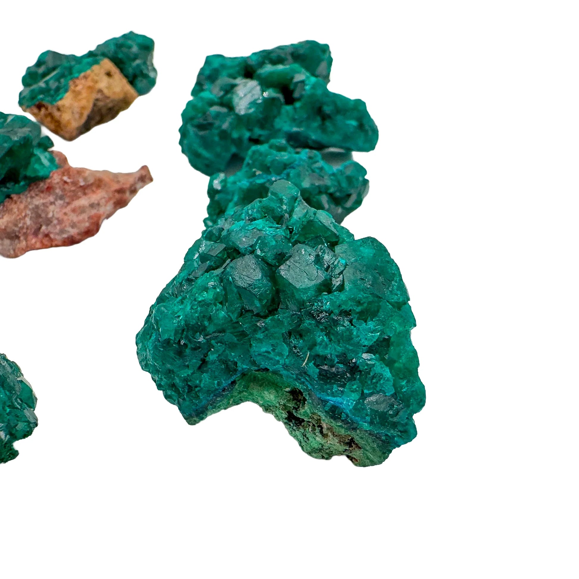 Profile shot of Dioptase raw stone, showing natural variation, sourced from Renéville, Republic of the Congo.