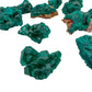 Looking down on green Dioptase raw stone, showing natural patina, from Republic of the Congo.