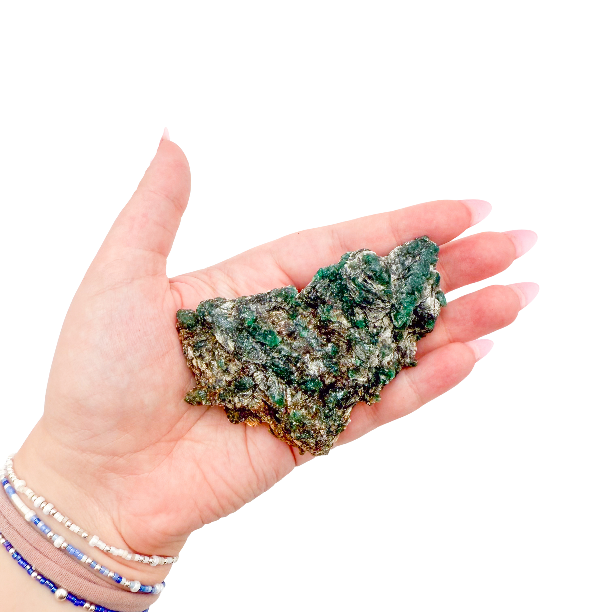 Raw emerald specimen from Zimbabwe held in hand to show scale