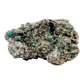 Raw emerald specimen from Zimbabwe, front view of green beryl in matrix