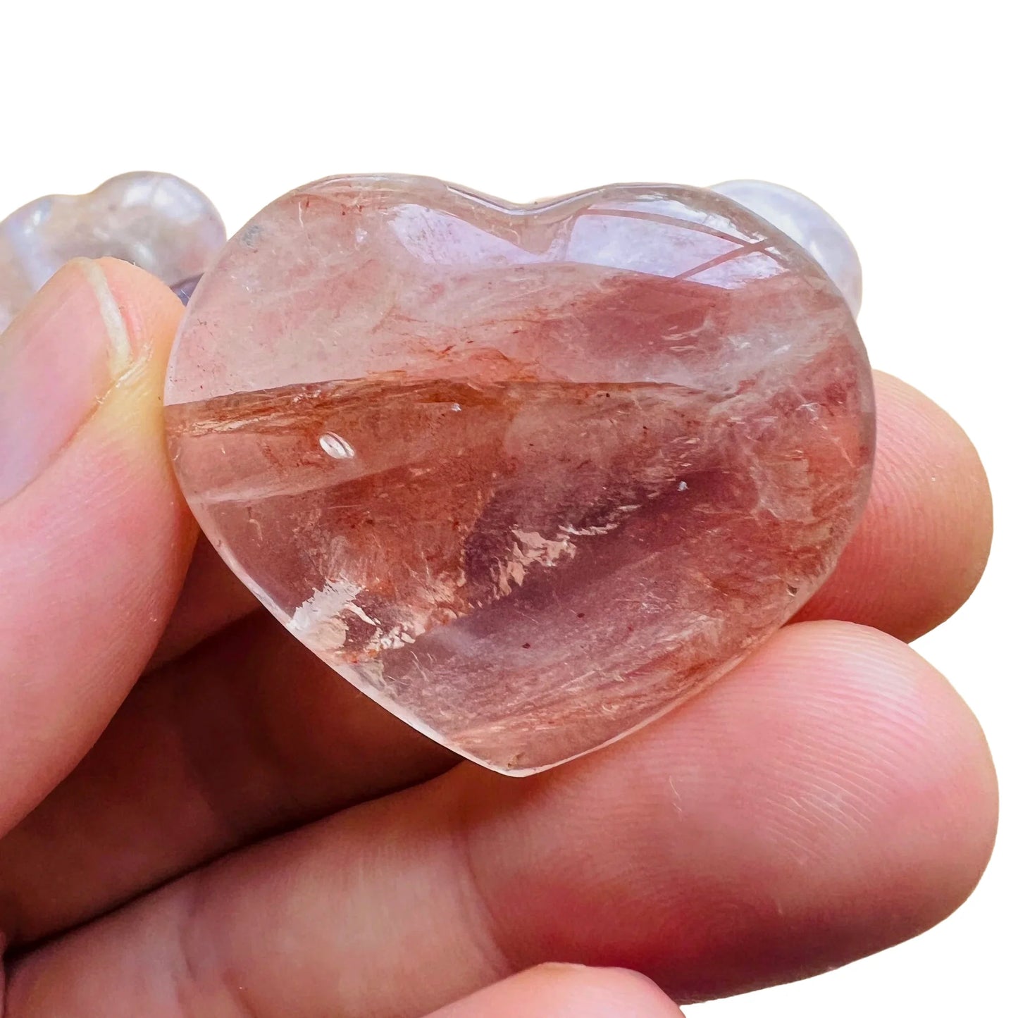Detail shot of Grade AA Fire Quartz heart under natural light
