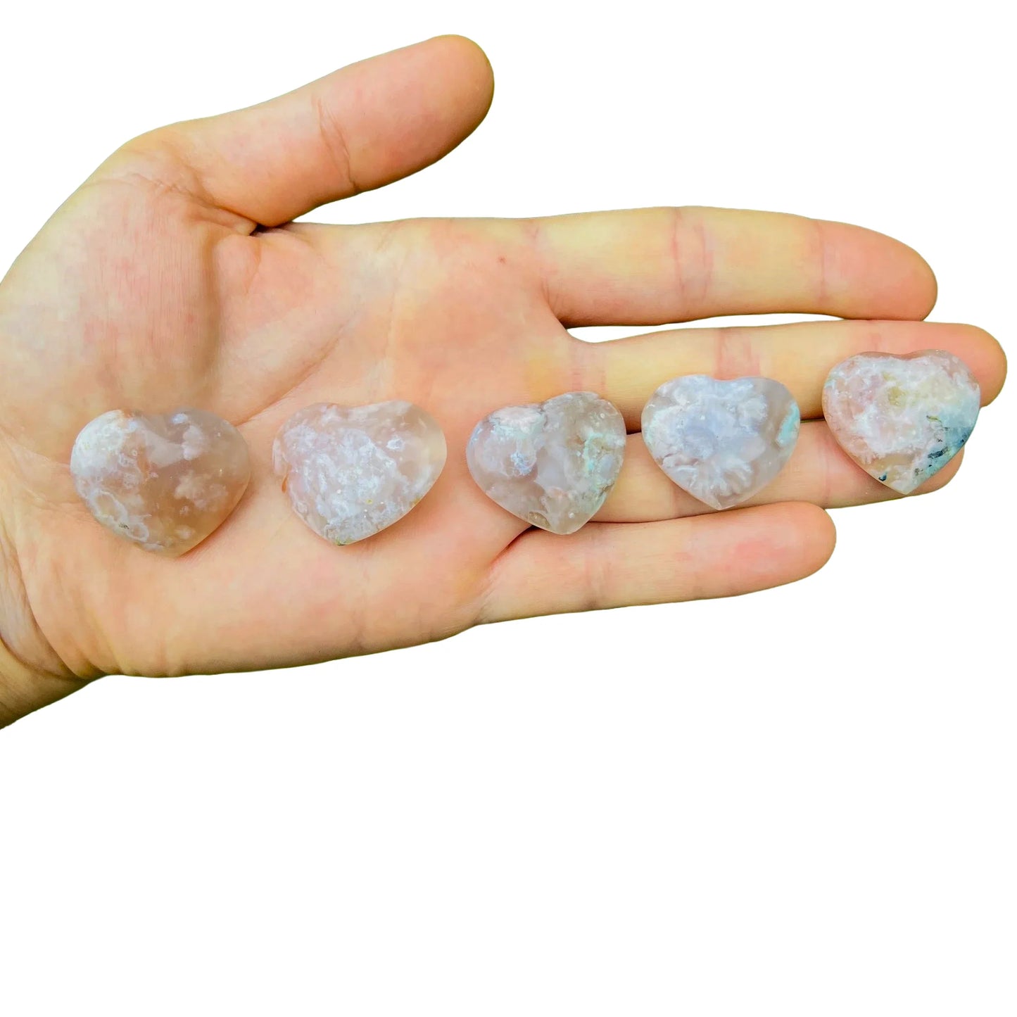 Detail capture of Flower Agate polished heart, showing subtle veining.
