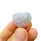 Edge view of Flower Agate polished heart, from Madagascar, carried for Love and Emotional Healing.