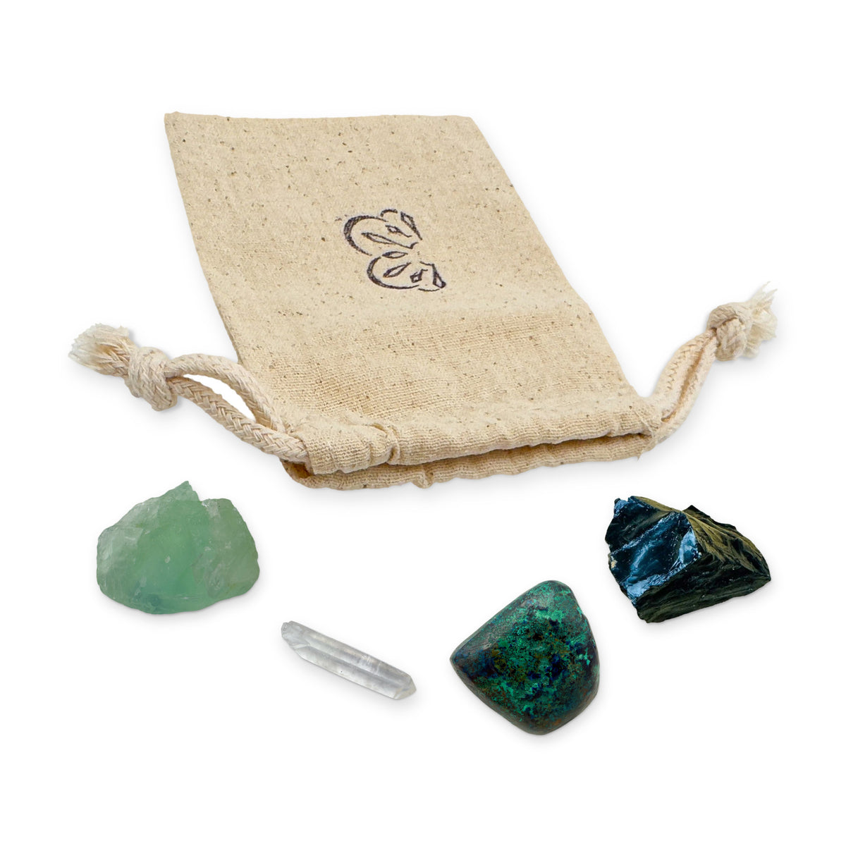 Focus Crystal Kit: fluorite, clear quartz point, azurite and black onyx, arranged with the reusable cotton bag they come in, on white