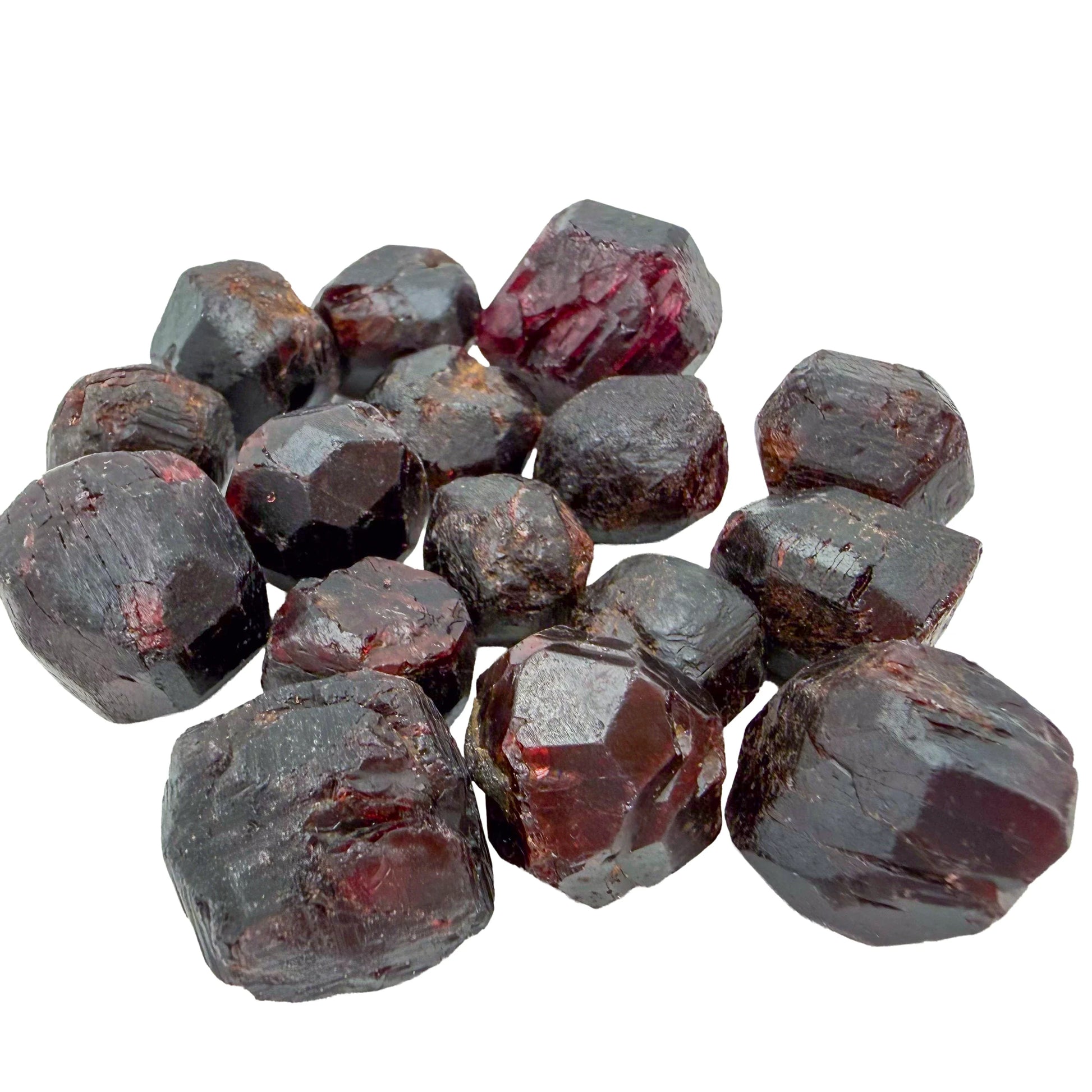 Pile of larger raw Garnet crystals showing crystal faces and glassy fracture surfaces