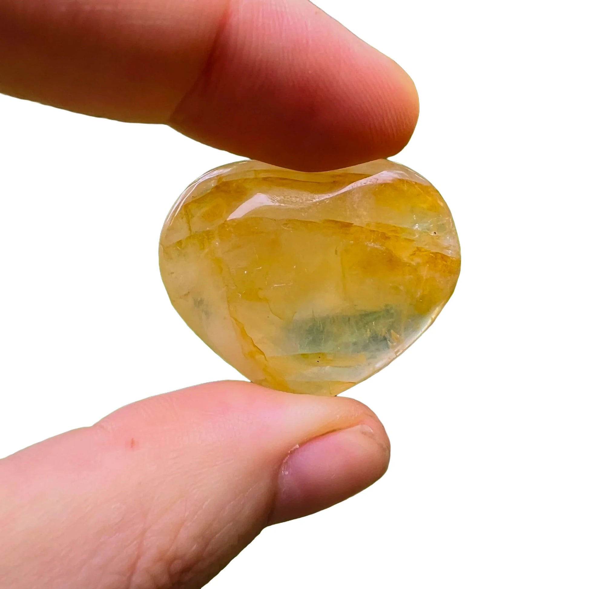 Edge-on view of Grade AA Golden Healer polished heart, sourced from Alaotra-Mangoro, Madagascar, showing natural texture.