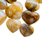 Looking down on Golden Healer polished heart, showing subtle veining, kept close for Healing.
