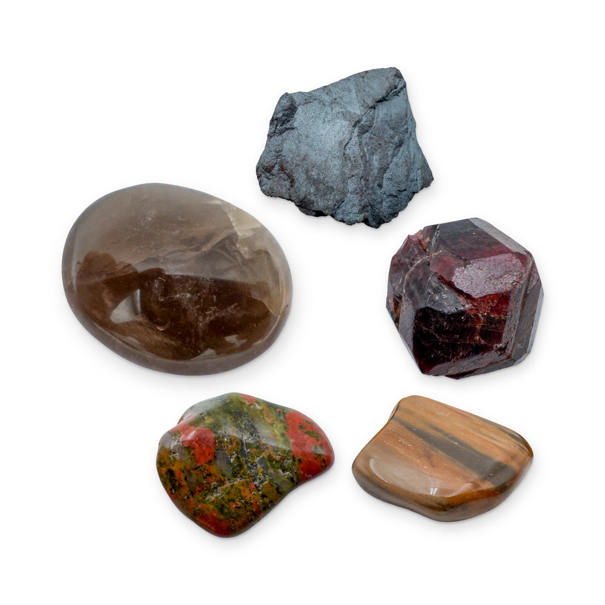 Grounding Crystal Kit: smoky quartz palm stone, hematite, garnet, petrified wood and unakite, shown together on white