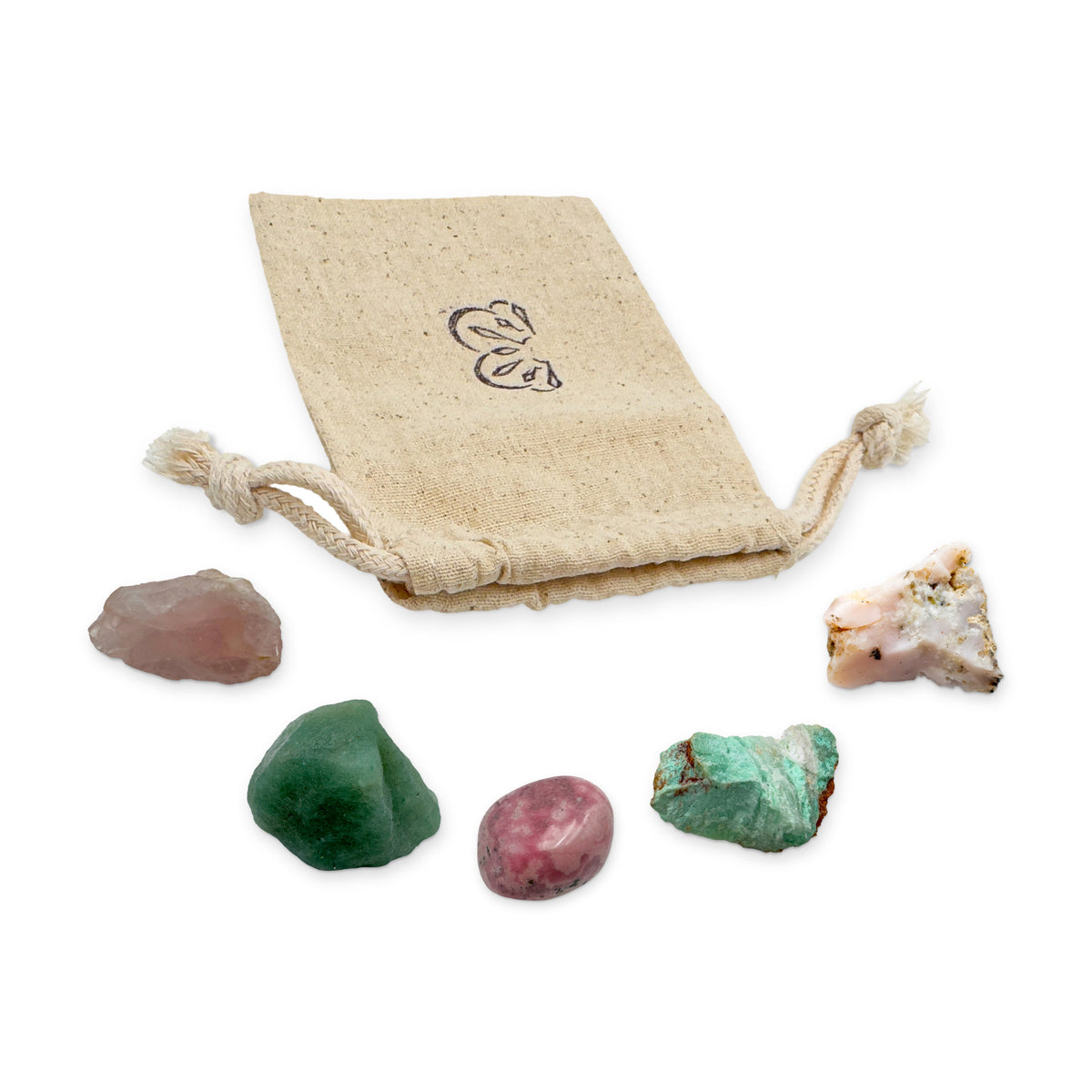 Heart Chakra Crystal Kit: rose quartz, green aventurine, rhodonite, chrysoprase and pink opal, arranged with the reusable cotton bag they come in, on white