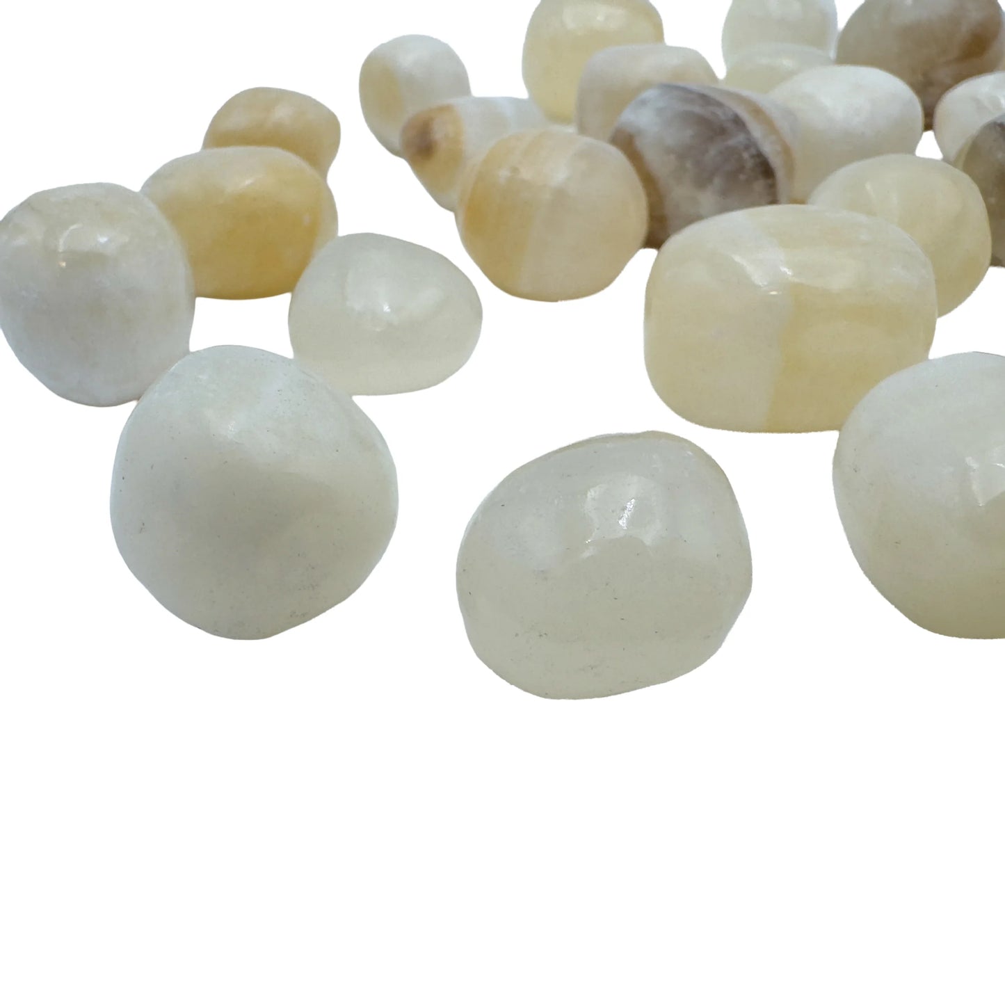 Close-up of polished golden-yellow Honey Calcite stones from Peru