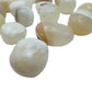 Single AA grade Honey Calcite tumbled stone with warm honey-gold color