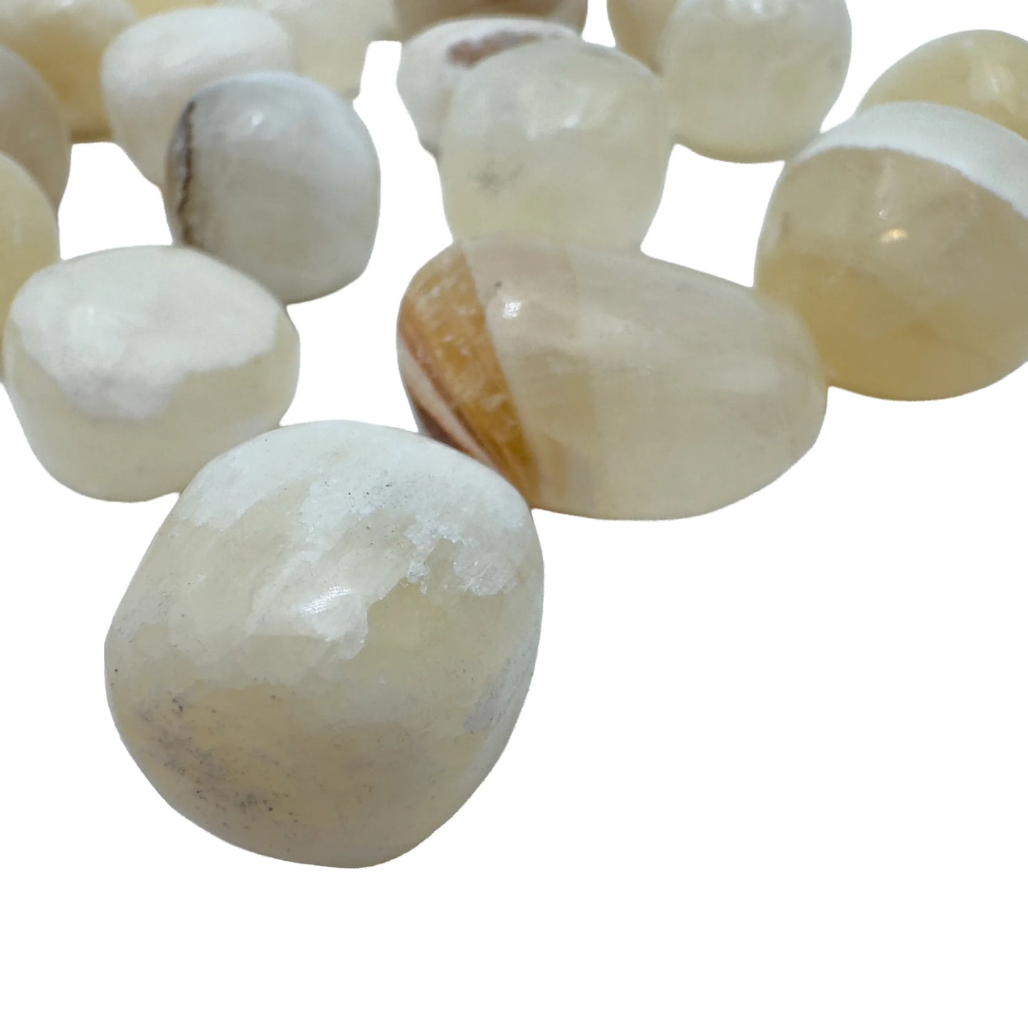 Single AA grade Honey Calcite tumbled stone with warm honey-gold color
