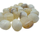 Bulk Honey Calcite tumbled stones piled together, warm golden crystals
