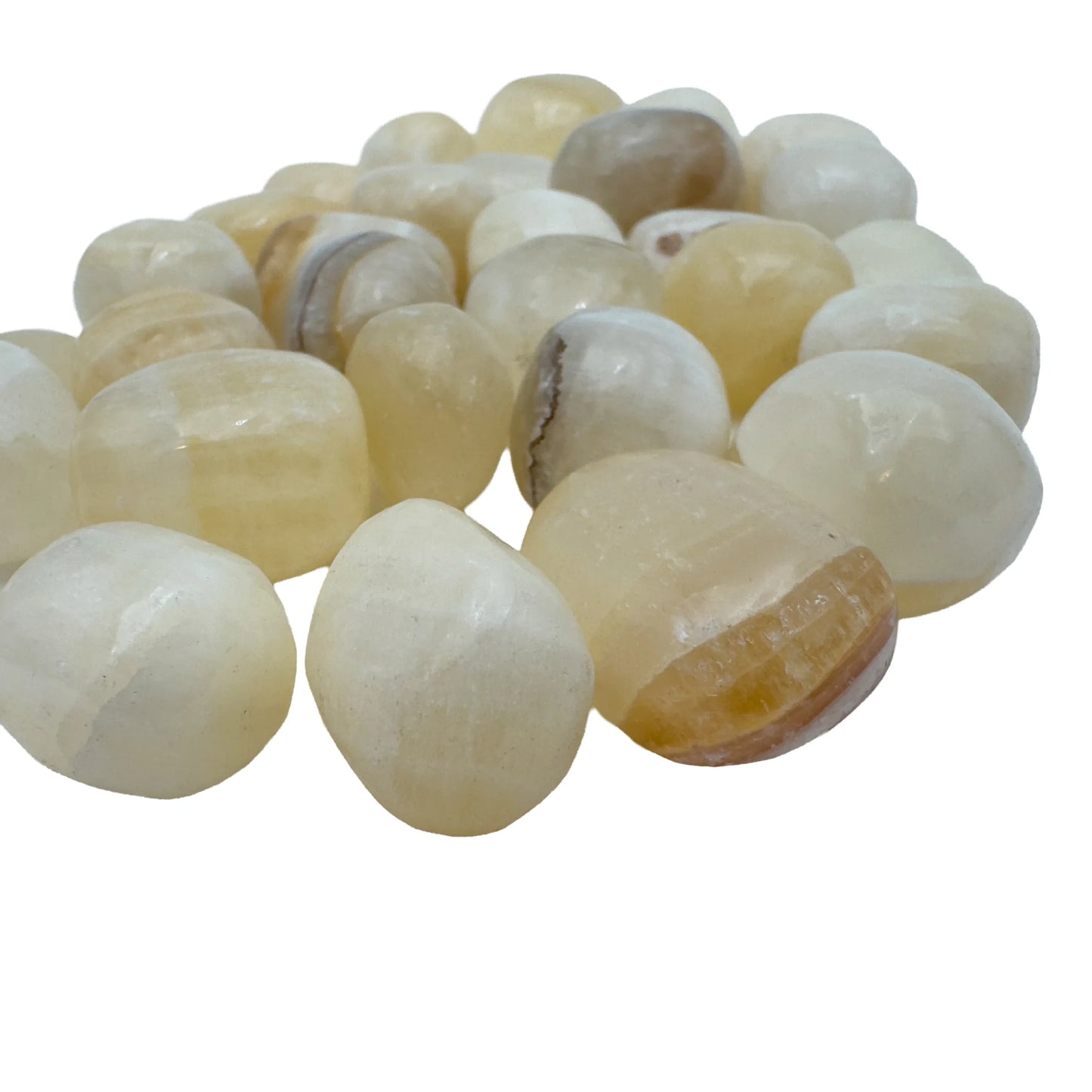 Bulk Honey Calcite tumbled stones piled together, warm golden crystals