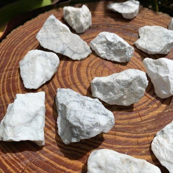 Grade a howlite raw held in hand for size reference