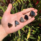 Back view of Grade AA Smoky Quartz tumbled stone showing natural surface