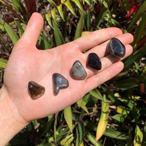 Back view of Grade AA Smoky Quartz tumbled stone showing natural surface