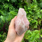 Side profile of Rose Quartz specimen, hand-selected from Alaotra-Mangoro, Madagascar, showing natural texture.