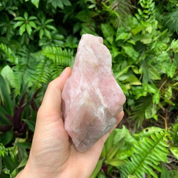 Side profile of Rose Quartz specimen, hand-selected from Alaotra-Mangoro, Madagascar, showing natural texture.