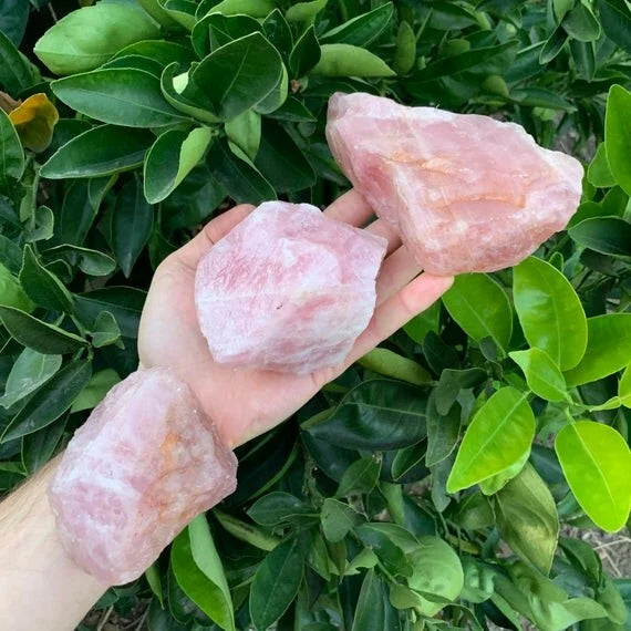 Detail capture of Rose Quartz raw stone, showing earthy tone.