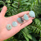 Full profile of a Grade AA Prehnite tumbled stone, ethically sourced from Namibia by Beyond Bohemian